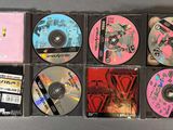many cd ' s in the case on the table