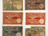 six different old french bank notes on a white surface
