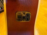 a guitar that is sitting on a wooden table