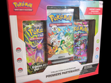 une photo d'une boîte de cartes Pokémon sur fond noir