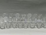 a lot of glasses that are sitting on a table
