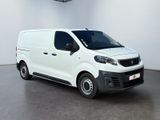 the white van is parked in a large white room