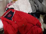 a pile of clothes that is sitting on the floor