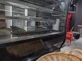a basket that is sitting on the counter in front of an oven