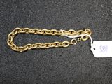 a close up of a chain with a tag attached to it