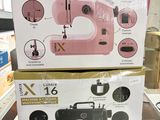 packaging of a pink sewing machine sitting on top of a table