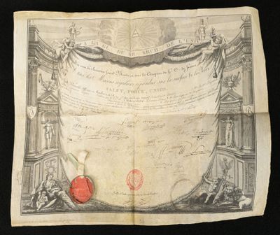 an old document with a red apple on it sitting on top of a table