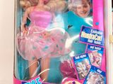 a barbie doll that is in a box on a table