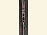a metal object that is hanging on the side of a wall