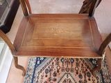 a small wooden table with a decorative design on it