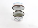 a small box with a lid that has a picture on it