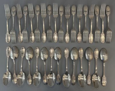 a group of silverplated forks and spoons on a table