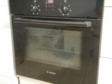a black oven that is built into the wall