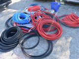 a lot of hoses that are sitting on the ground