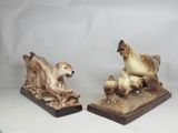 pair of ceramic figurines of a dog and a chicken