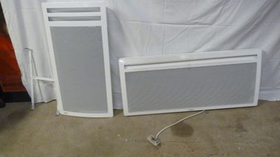 two speakers sitting next to each other on the floor