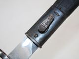 a close up of a knife with a metal handle