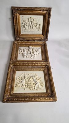 two framed pictures of a man and woman on a horse