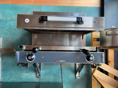 an image of a commercial gas oven in a kitchen