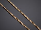 a gold chain on a black background