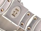 a close up of a watch on a white surface