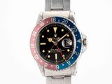 an image of a wrist watch with a red, blue and yellow bezel