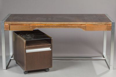 an image of a desk with a file cabinet underneath it