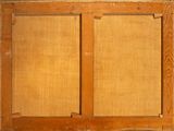 a close up of an old wooden window with a wooden frame