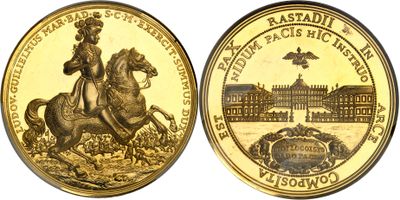 a close up of a gold coin with a picture of a man on a horse