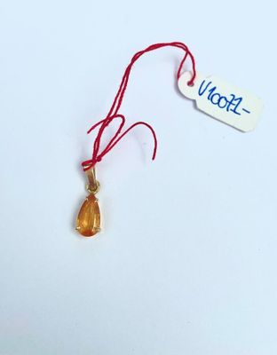 a small piece of glass with a red string attached to it