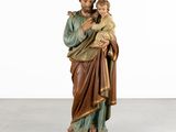 a statue of jesus holding a child in his arms