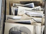 a box full of old photos of a man and a woman