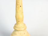 a small yellow candle that is sitting on a table