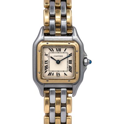 a close up of a wrist watch with a gold and silver bracelet