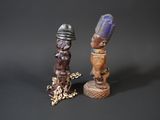 pair of carved wooden figurines of a man and a woman