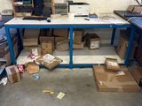 a desk with a lot of boxes and a computer on it