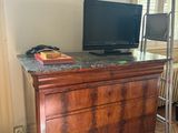 a desk with a computer on top of it in a room