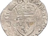 an old silver coin with a crown on top of it