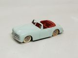 a toy car that is sitting on a white surface