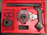 a tool in a red box with a wren and a hammer