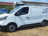 a white van that is parked in the grass