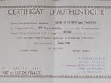 a certificate on a piece of paper that is on a table