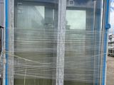 a picture of a blue and white container house on a pallet