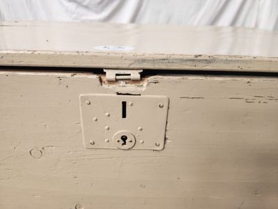 a white box with a lock on the inside of it