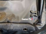 a swiss fly logo on the side of a backpack