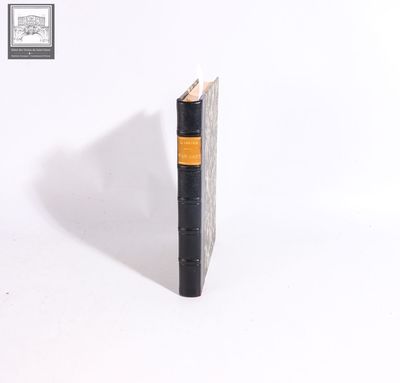 a black book with a yellow strip on it