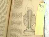 an open book with a drawing of a light bulb on it