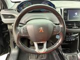 the interior of a car with a steering wheel and dashboard controls