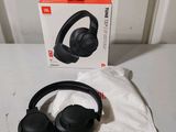 an image of a pair of headphones sitting on top of a table