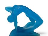 a blue sculpture of a man on a surfboard